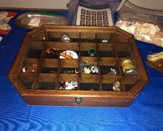 display case with odd pieces