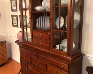 Ducks unlimited Lighted cherry china hutch with glass display space, silver drawer and plate rack. 