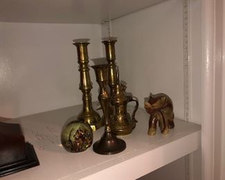Collection of brass candlesticks, paperweight, elephant