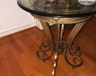 close up of wrought iron table with glass top