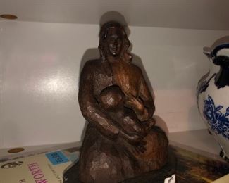 hand carved wood “nursing mother” statue