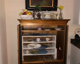 repurposed entertainment cabinet with vintage kitchen decor items, canvas art work nicely framed 