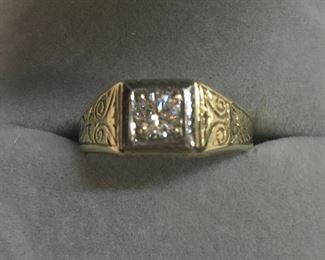 Very good gold and diamond mans ring.  We have an appraisal dated last fall. 
