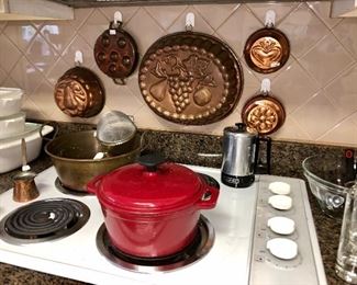 Red cast iron Dutch oven, brass preserves pot, antique French copper molds