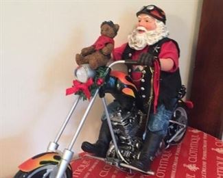 Clothtique bikers who care toy drive Santa on Harley