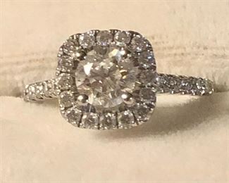 .70k center diamond, diamonds surrounding the diamond and band, engagement ring, with original paperwork 