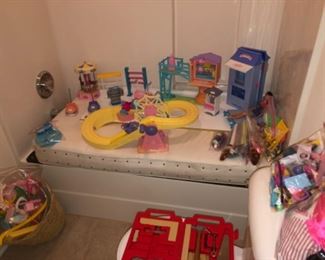 Barbie doll accessories, go-carts, roller coaster, additional carnival pieces
