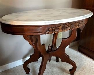 Mahogany marble top oval table by Kimball 
