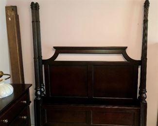 Ashley dark bedroom furniture consisting of a queen four poster bed (post can be adjusted to various heights), dress with mirror, mans chest.  