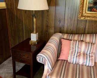 mahogany end table, 1970’s marble and brass lamp, camel back sofa by Clayton Marcus 