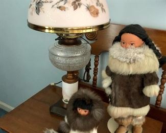 antique oil lamp and Eskimo dolls