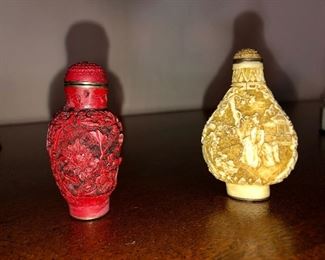 Cinnabar snuff bottle and a natural color carved snuff bottle