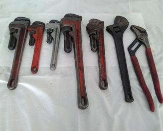 Five pipe wrenches, one crescent wrench and one adjustable lock crescent