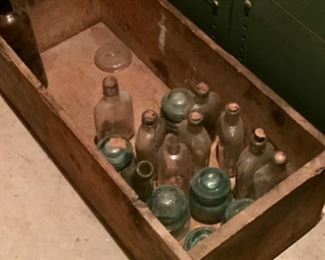 Antique bottles and insulators.
