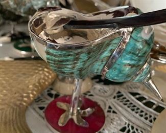 Staff's pick top ten. Snail shell, silver plated & footed servers: Notice the sliced Geod plated foot. Tons of MOP caviar spoons with sterling and silver plate accents. Custom-made for the cllent's tableware.