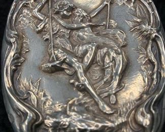 Sterling repousse brush top.