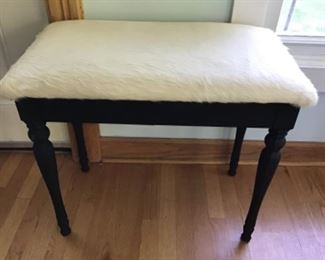 Ebony and Ivory flip top piano bench with hair on skin cowhide. $285 . Reupholstered 