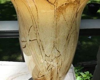 12 inch tall blown glass vase with brown and gold marbleized throughout the vase $30