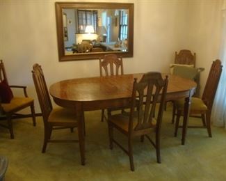 Dining table w/ 3 leaves and 6 chairs. Extends to 96"