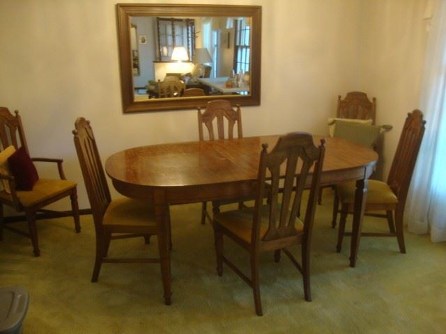 Dining table w/ 3 leaves and 6 chairs. Extends to 96"