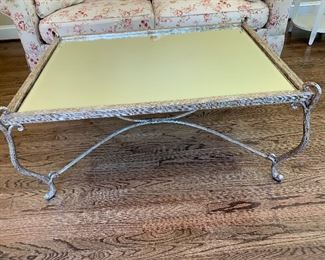 Beveled glass top coffee table with metallic metal legs