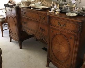 Buffet, mantle clock, silver serving pieces