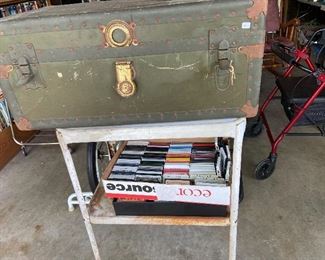 old trunk, metal table, cassette tapes.