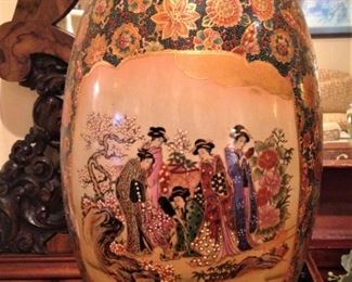 One of two large hand-painted egg shaped  Asian decor