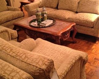 Beautifully upholstered sofa with matching ottoman, swivel chair, and two recliners