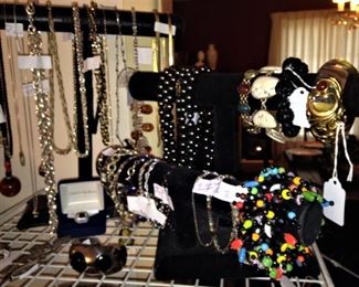Many bracelets and necklaces