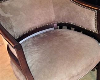 Barrel-back upholstered chair with nail head detailing