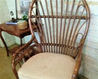 One of two rattan oval back chairs