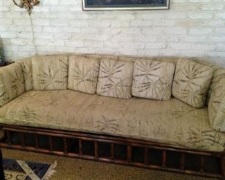 Rattan sofa with extra pillows