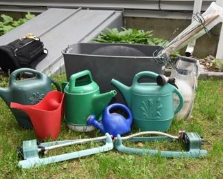 ITEM 41: Gardening Lot  $25
Watering cans, lawn sprinkler, hose nozzles, plant stakes, brand new multipurpose sprayer