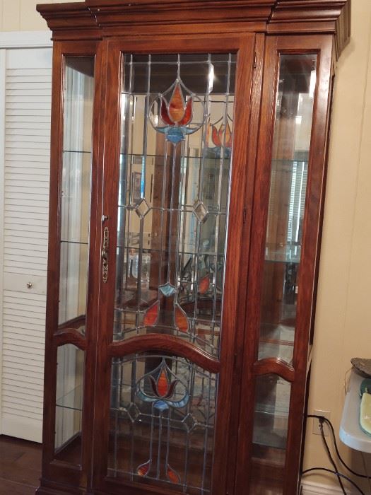 Curio / China cabinet beveled glass, lighted, with stained glass. Excellent condition. $500