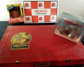 Walt Disney Peter Pan hand puppet, a stainless steel Slinky and 1940s Erector set in metal case. Also an unused Browns/Steelers checkers game.