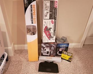 Large lot of hunting equipment. Including Outpost Elite hunting ground blind, appears to be new in box. Gunsmiths Maintenance Center. A guide gear rifle scope, a Dynamo album urgency TV. A Bentley portable tv and a pair of Tasco binoculars.