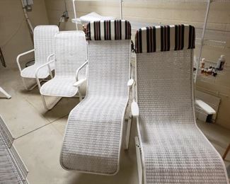 Four piece patio chair set in white wicker by Lloyd Loom. Set includes two chairs that rock and two lounge chairs that also rock. All weaving is in very good tight condition. Very minor scratches on the paint finish. Over all the items are in great condition. Lounge chairs are approximately 54 in long.