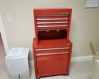 Like new Craftsman storage chest. Item is in great condition and has been stored in the basement. There are no visible signs of rust, dents, scrapes or anything worth noting. Cabinet system is on wheels for easy movement. Measures approximately 27 in across by 14 in deep and 53 in tall. At this point we do not have the keys.