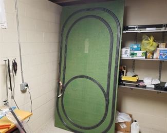 Train table measures approximately 4 feet by 8 feet. Item is very heavy and is located in the basement of the home. It is pre-wired but no testing was completed on the track.