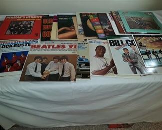 An assortment of 27 records including The Beatles, The Four Seasons, Stevie Wonder, The Beach Boys & many more!