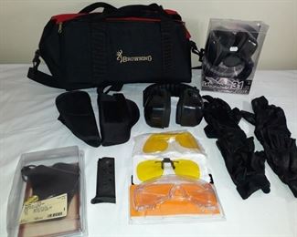 Ear muffs, Cabela shooting gloves, safety glasses, holsters and ammo holder with carrying case.