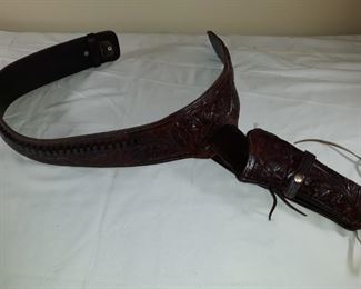 Embossed leather holster 40W with 22 cal ammo holders. Never used.