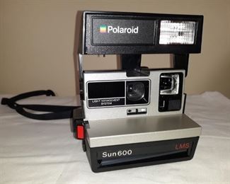 Polaroid Sun 600 camera with carrying case