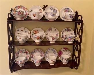 This hanging wooden shelf is 2ft tall, 2ft long and has a depth of 1/2ft. The tea set on the shelf is not included