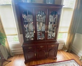This Knob Creek China Cabinet is 6.5ft Tall, 5ft Long with a width of 1.75ft. It does not include the contents inside or on top of the cabinet.