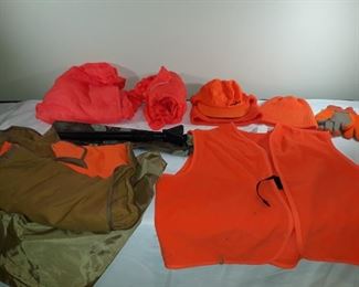American Field detachable pouch Cabela's vests. 2 vinyl rain ponchos, Cabela's knit and visored cap and plain stocking cap. Multipurpose telescoping stand with case that opens to 57".