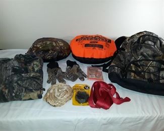 Heavy weight Mossy Oak shirt (womens XL) backpack by Fieldline with a blue water holder, 2 reversible 'hot seat, pads, misc utility ropes and straps and a pair of gloves.