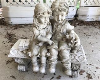 boy and girl on bench garden figure