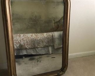 antique mirror  shows bed